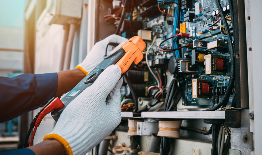 Technician testing an electrical system